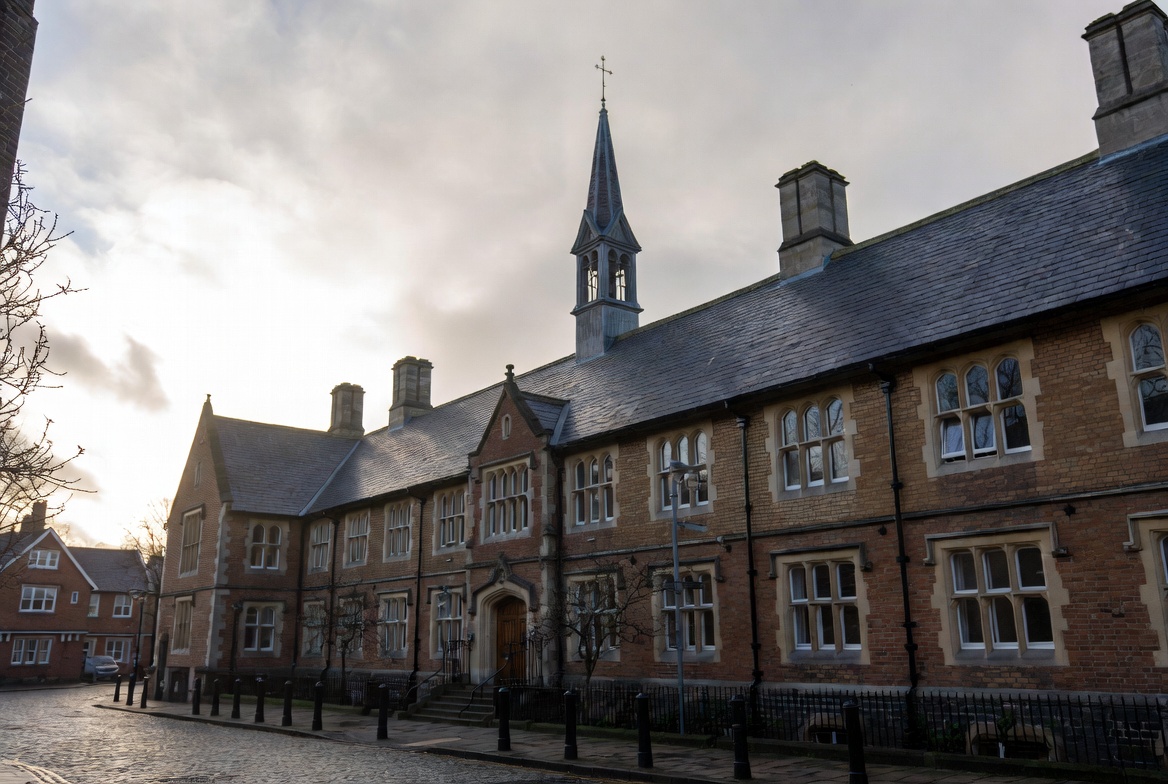 Traditional high school with cloudy sky in the background